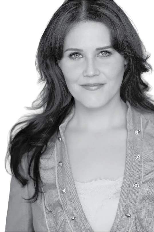 Black and white portrait of Anya Sleezer, founder of Levo, smiling